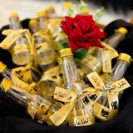 توزيعات ماء زمزم مكونة من 12 علبة حجم 13 سم توزيعات ماء زمزم مكونة من 12 علبة حجم 13 سم